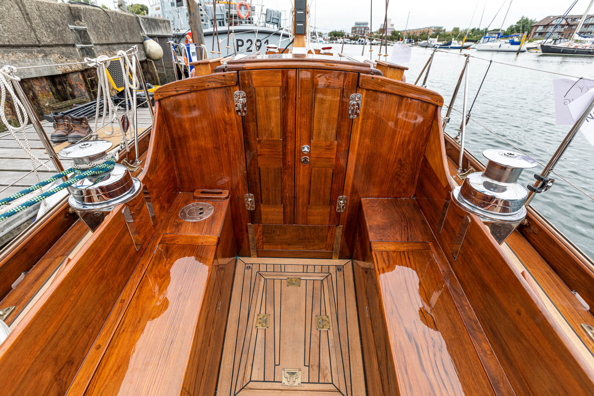 A classic wooden yacht being carefully restored